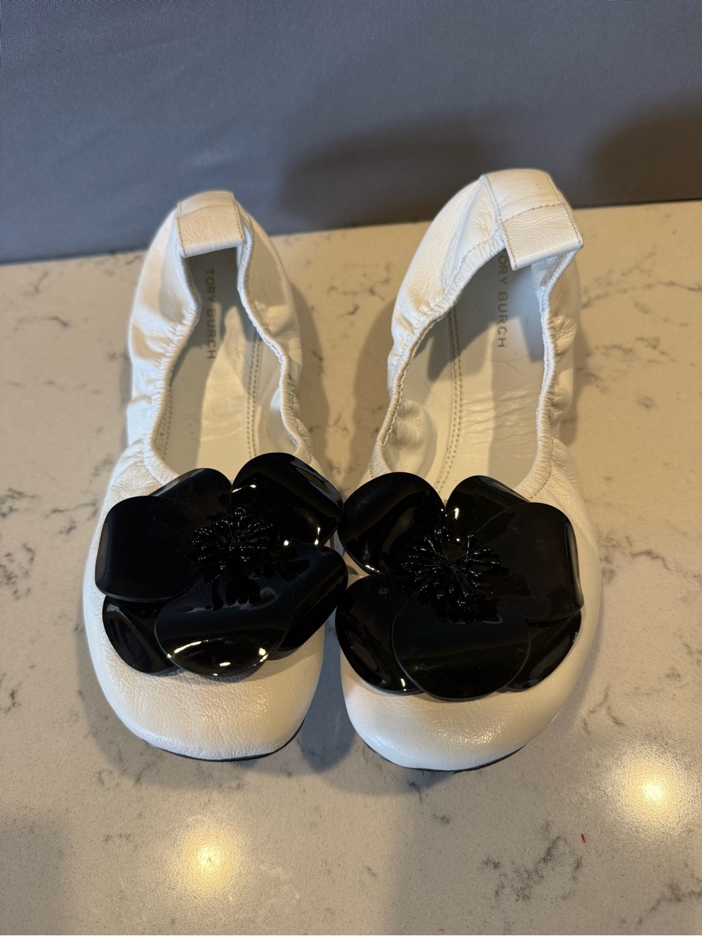 Tory Burch White Leather Flats with Black Floral Appliqués
